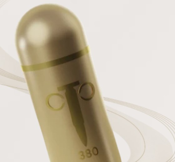 Golden Bullet 380 capsule on a light background with orbit lines